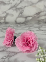 Pink flowers on a marble surface